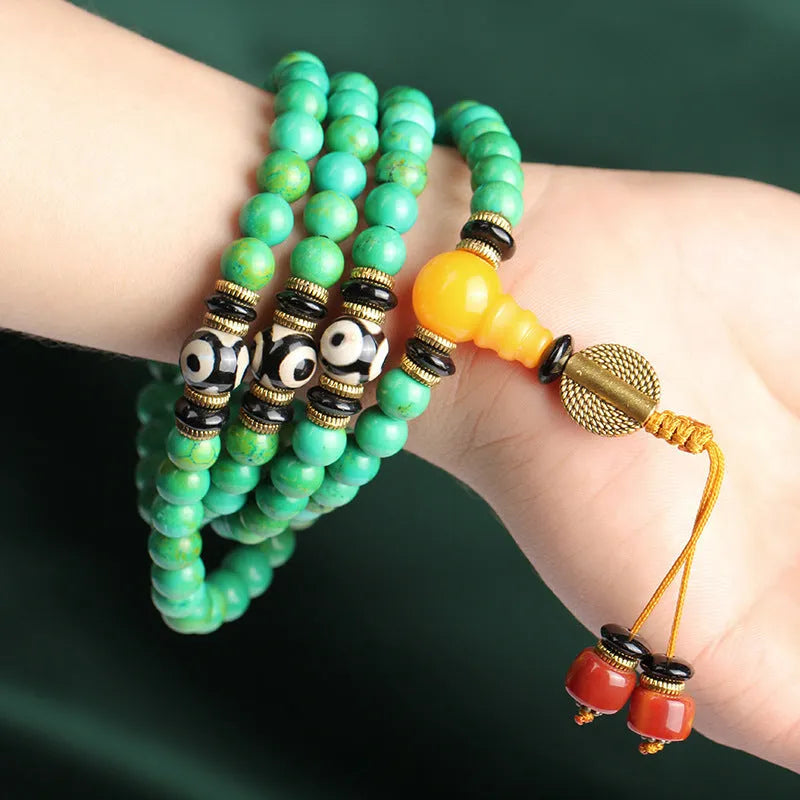 Natural turquoise gemstone bracelet with 108 round 8mm polished beads.