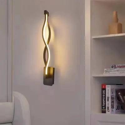 LED wall lamp with silicone shade in black or white finish showing button switch control