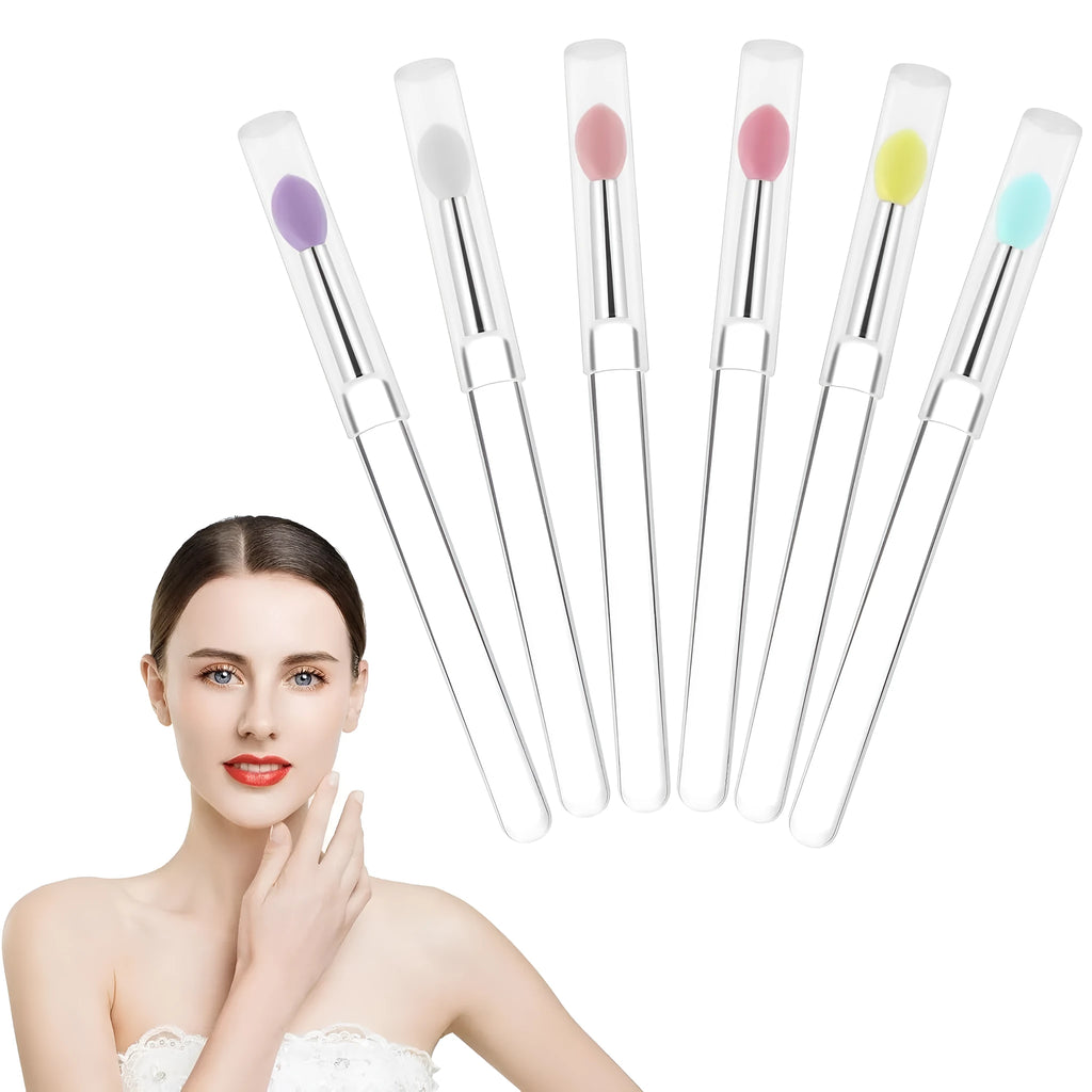 Set of four silicone lip brushes with protective caps in various colours for makeup application