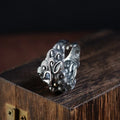 Silver open ring with domineering jibeast pattern showing animal zodiac modelling details