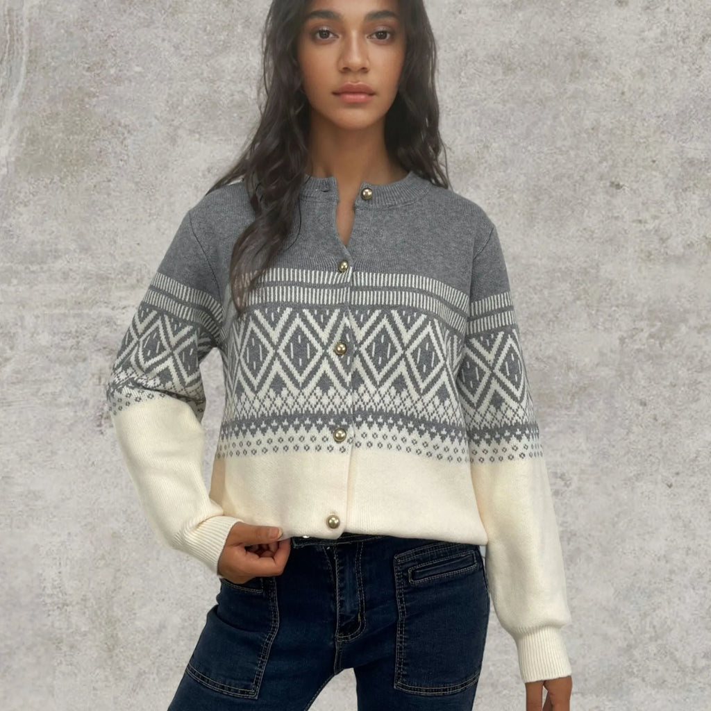 Women's grey alpaca wool cardigan with long sleeves and a diamond knit pattern in contrasting colours.