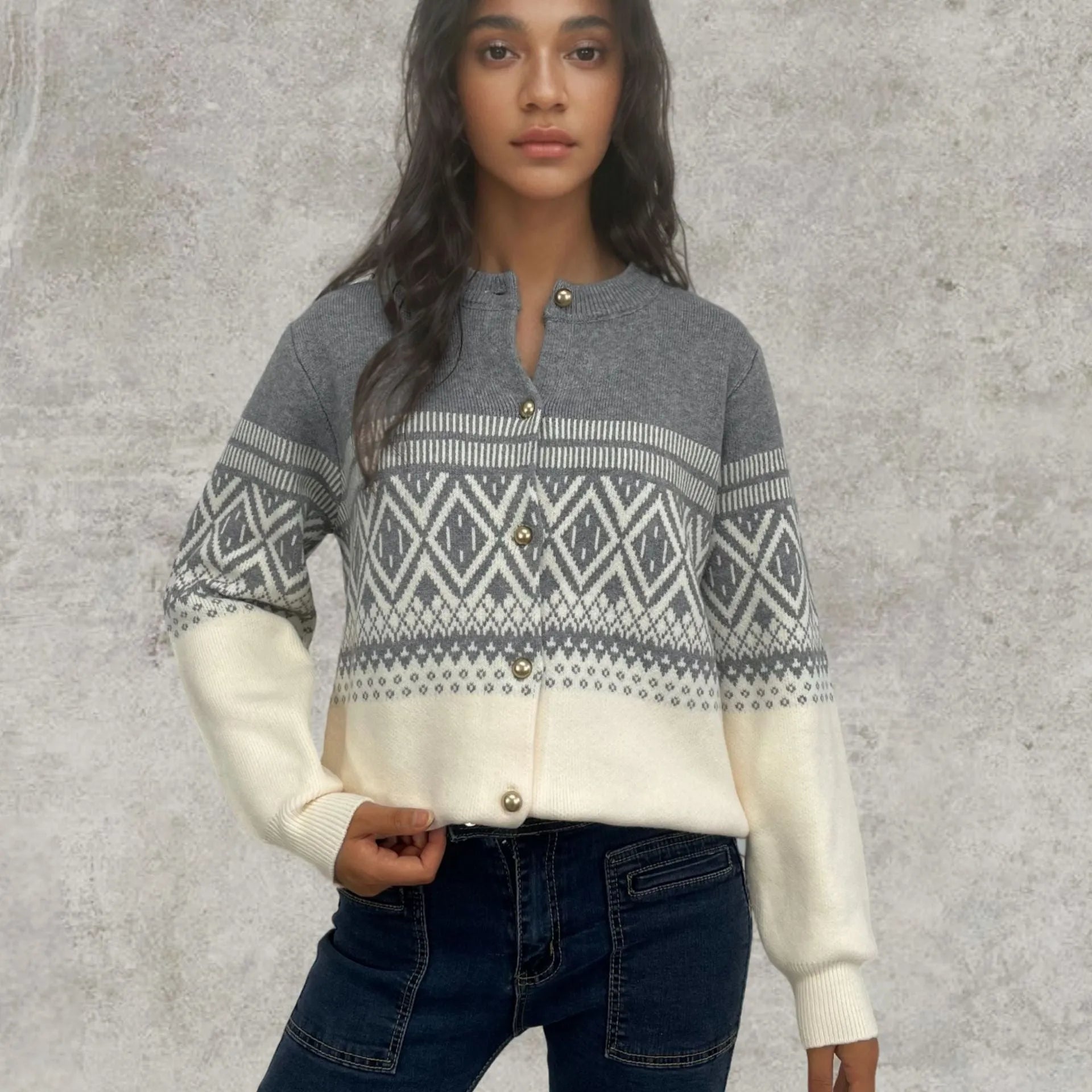 Women's grey alpaca wool cardigan with long sleeves and a diamond knit pattern in contrasting colours.