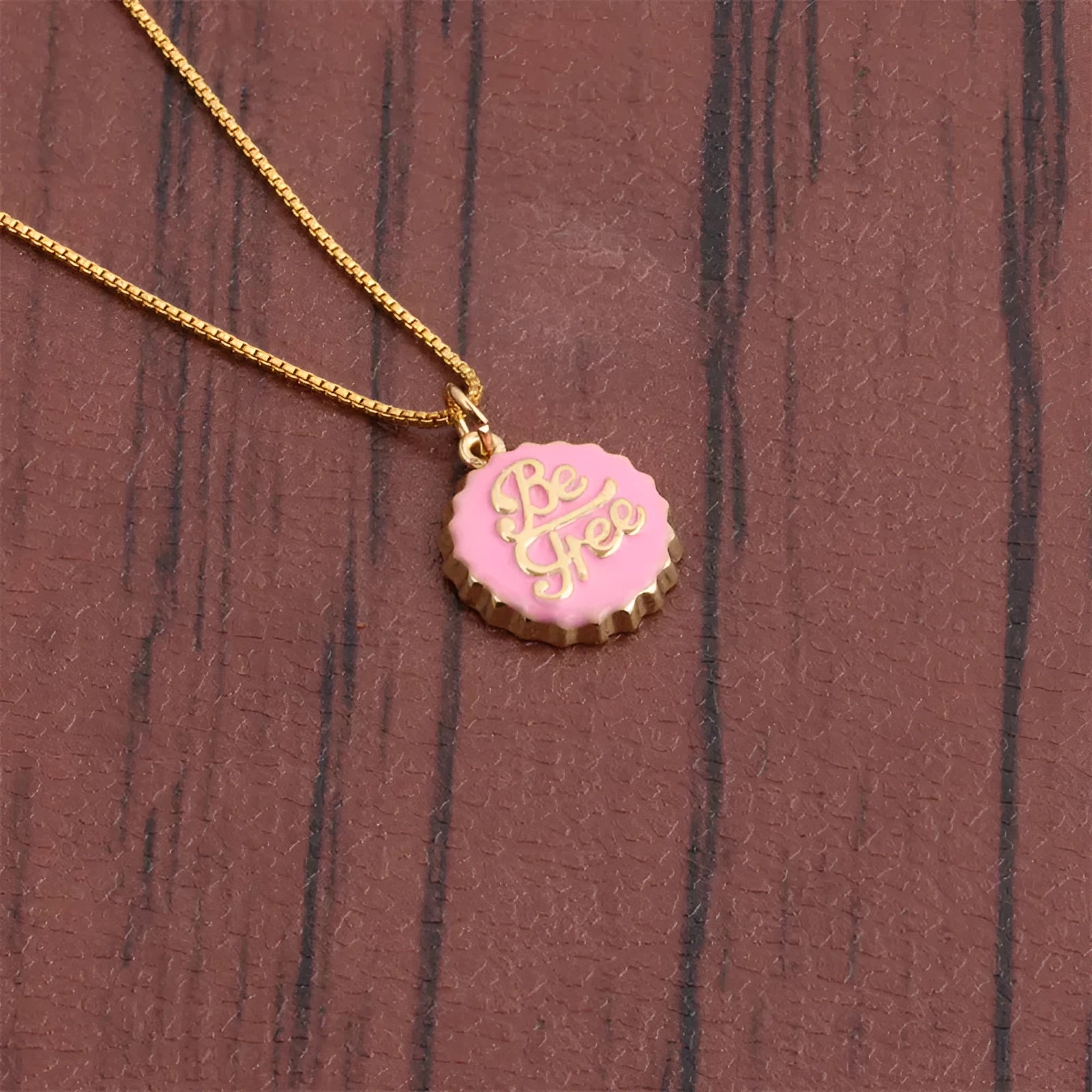 Copper bottle cap pendant necklace with gold electroplating on a 40cm box chain.