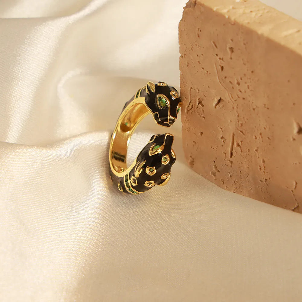 Black geometric open ring with cheetah oil drip pattern, size No. 7.