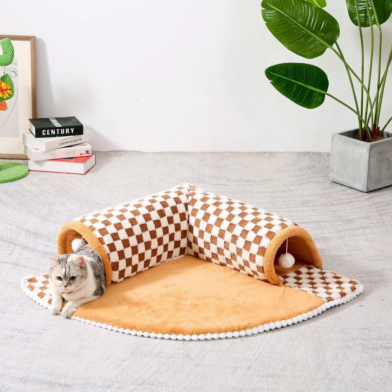 A coffee-coloured plush fan-shaped pet bed with an attached tunnel for cats and dogs.