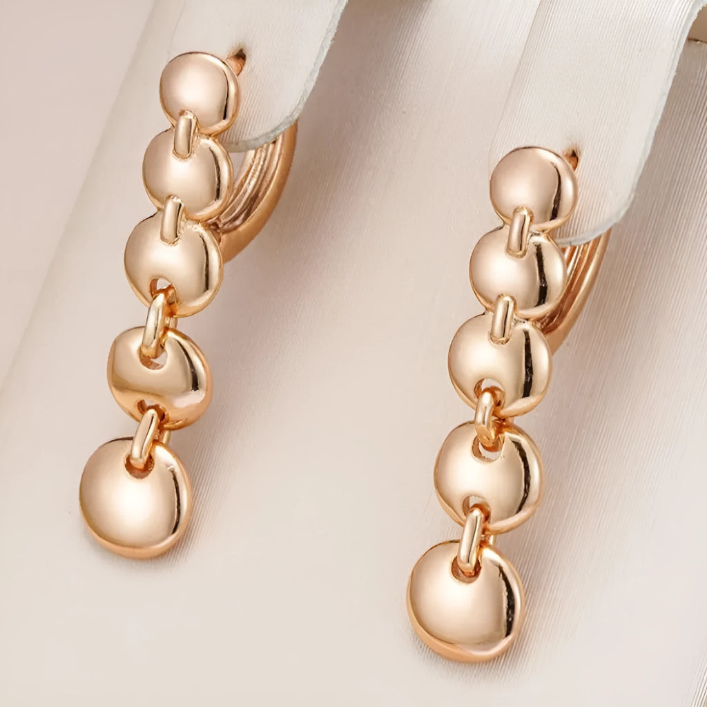 Retro gold-coloured copper circle earrings with woven texture and long dangle design