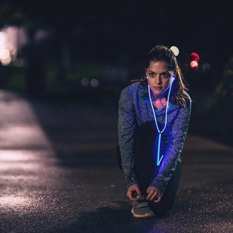 Blue Magic Light LED earphones with illuminated light lines, 3.5mm plug, and remote microphone.