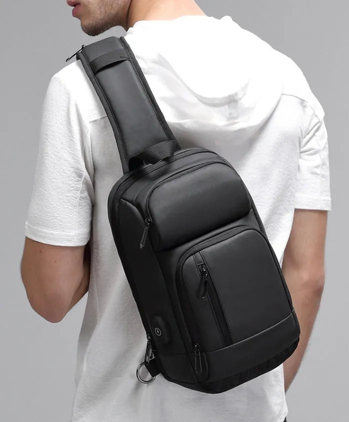 Black PVC outdoor leisure shoulder bag with air cushion strap showing organisational pockets