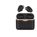 Black wireless Bluetooth headset with charging stand on a table.