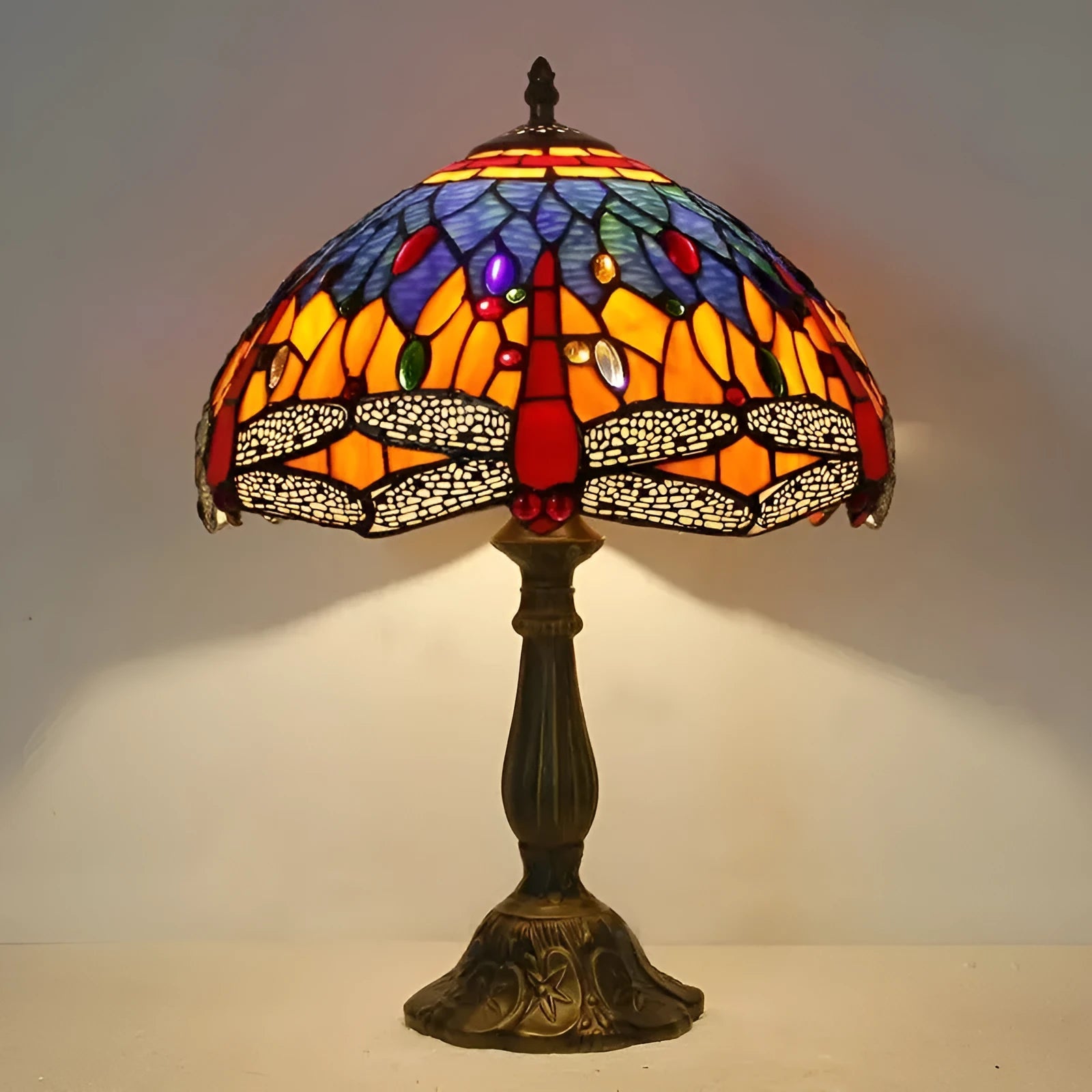 Stone table lamp with Tiffany-style blue dragonfly design on base