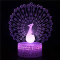 Small acrylic 3D touch-controlled USB table lamp with colourful crack-effect base on a desk.