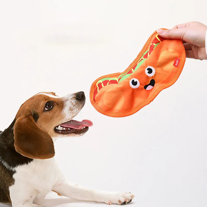 A set of four colourful crinkle and squeak dog toys shaped like a burger, fries, a hot dog, and a pizza.