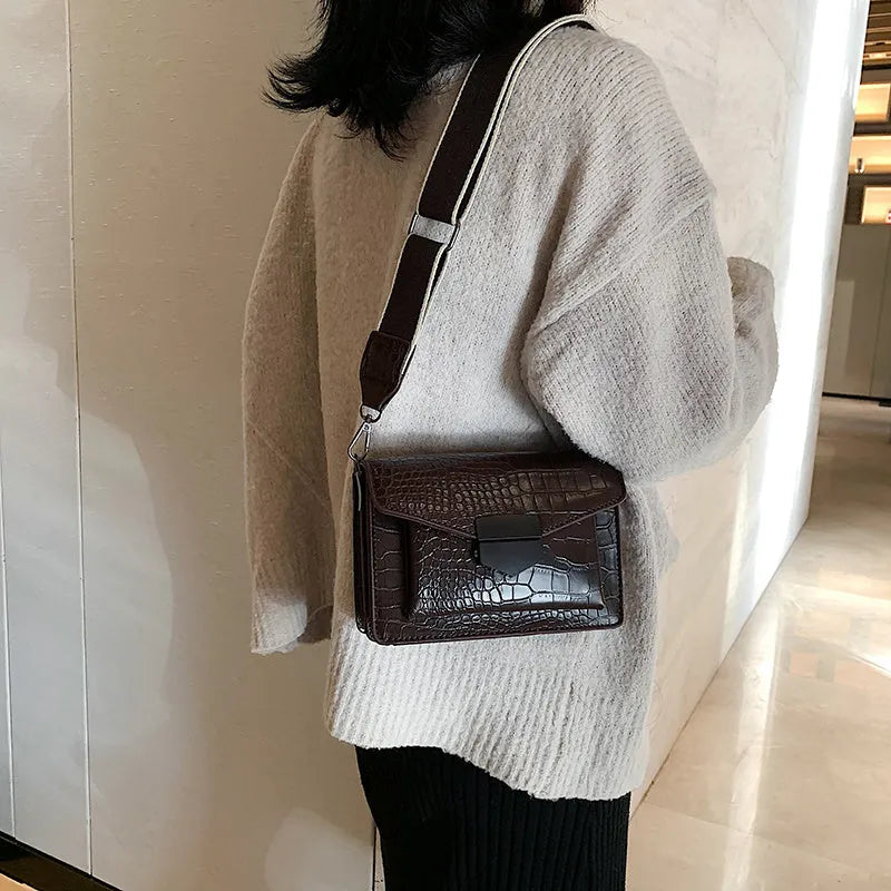 Vintage PU crossbody bag in black, dark brown, khaki, or red with dimensions 20cm wide by 14cm high.