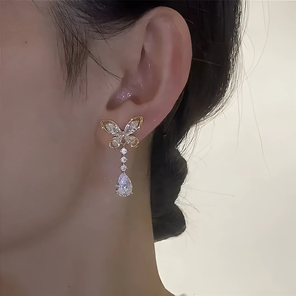 Women's bow stud earrings with electroplated platinum finish on zinc alloy