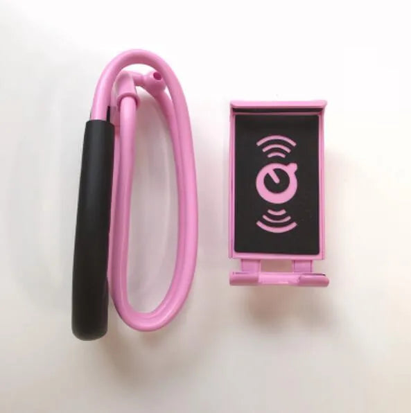Universal 360-degree rotating phone holder in multiple colours on a table, holding a smartphone.