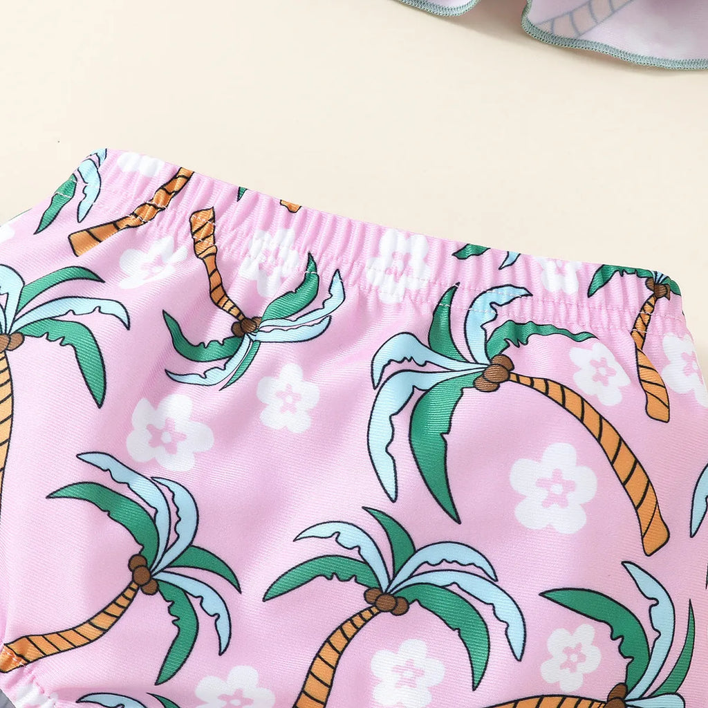 Girls' white two-piece swimsuit set with a shirt top and shorts on a hanger.