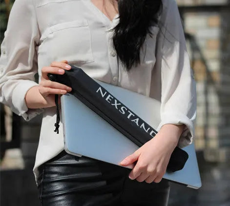 Black folding laptop stand with reinforced nylon construction showing compact folded position