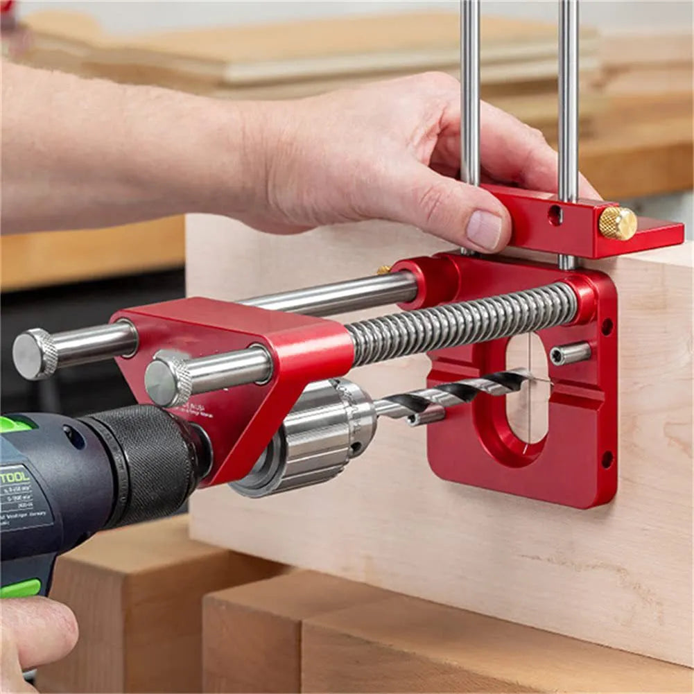 Woodworking drill locator with metal body and red or black durable polymer section for wood drilling