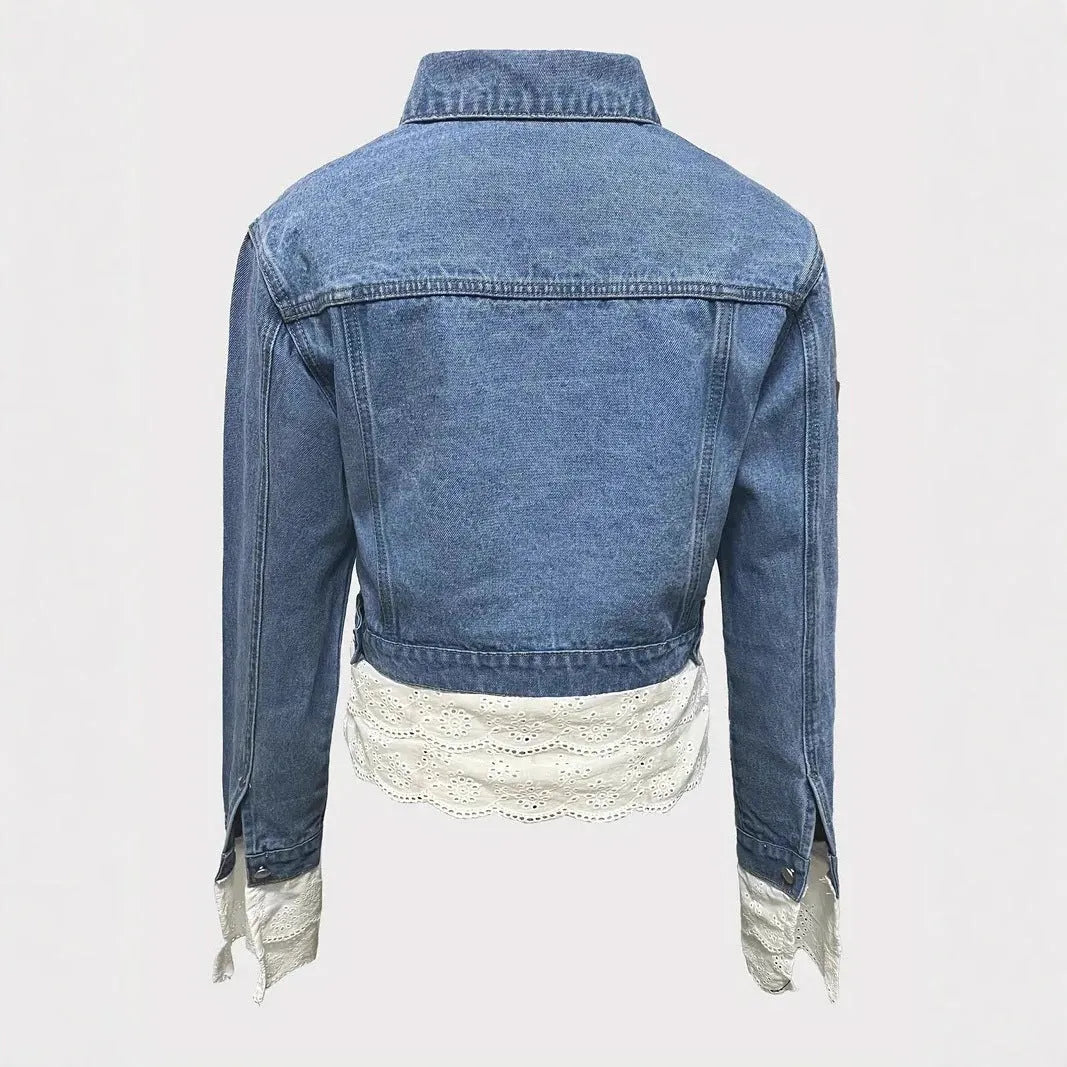 Blue women's denim jacket with decorative lace stitching detail on the front.
