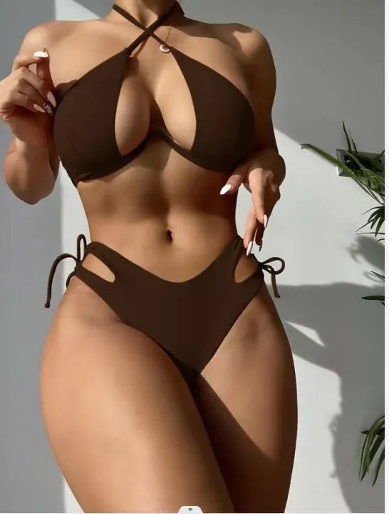 Women's solid colour halter bikini swimsuit with backless briefs in black, blue, or brown.