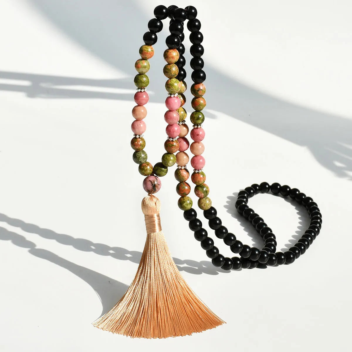 Handmade long beaded necklace with gemstone pendant and tassel, showing 81cm+ length.