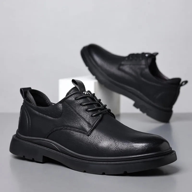 Men's black leather casual sneakers with sewing line detailing and rubber soles