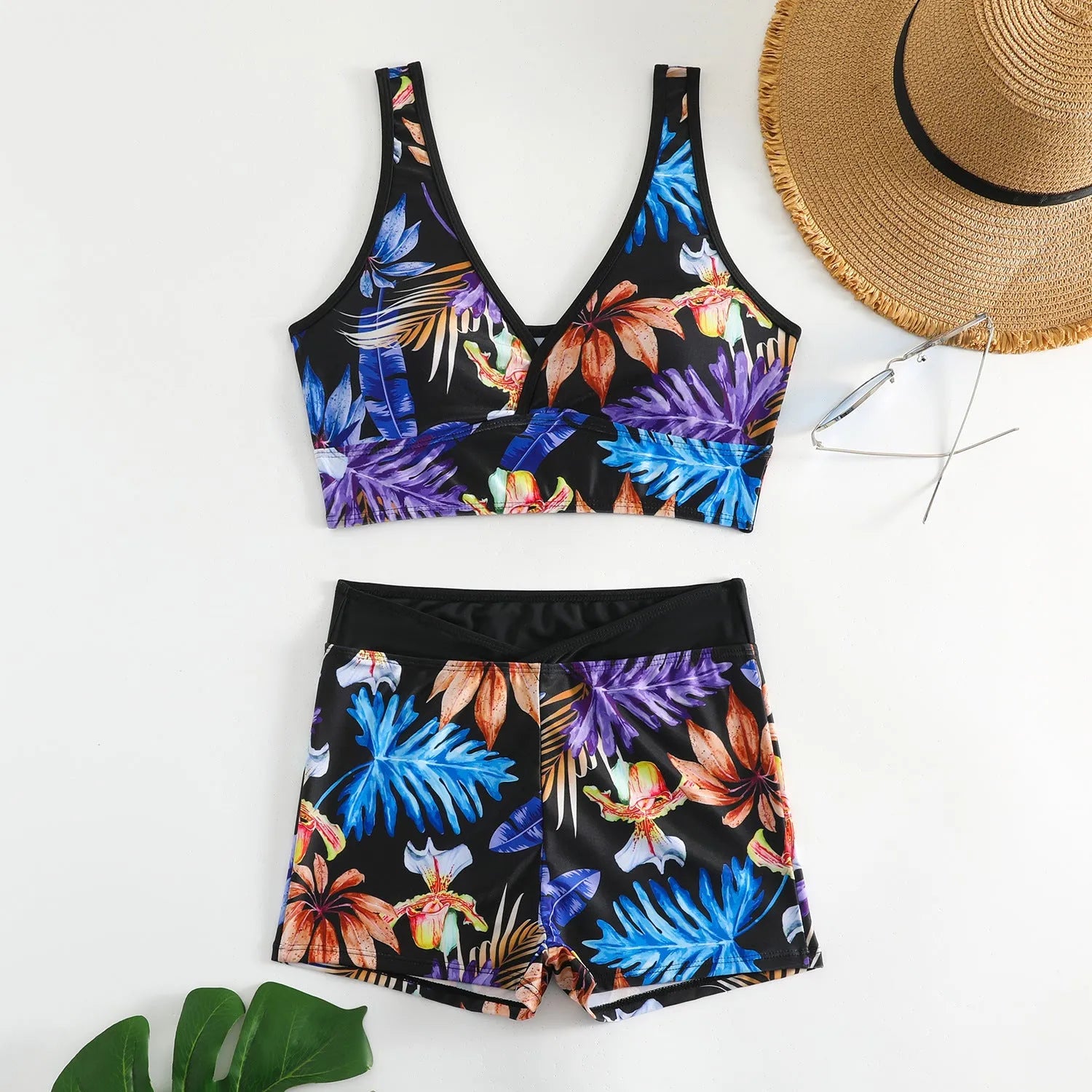 Women's two-piece printed swimsuit set with a sleeveless top and boxer-style briefs in a multicolour pattern.