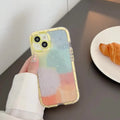 Minimalist contrast colour silicone iPhone case with yellow edge trim on phone