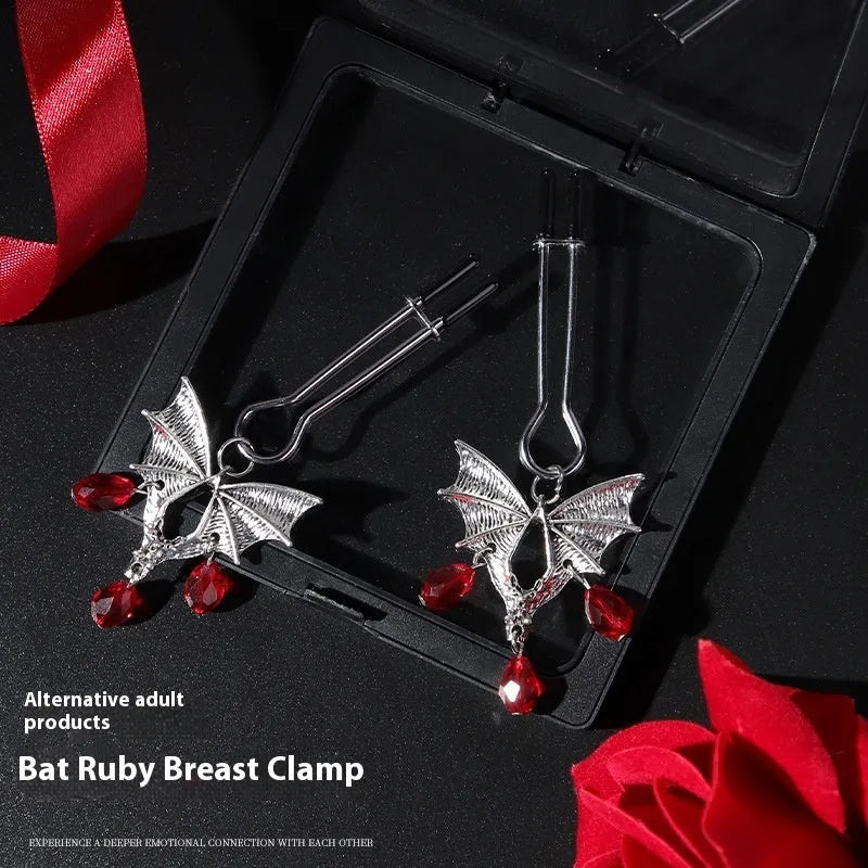 Silver bat nipple clamp with adjustable ruby clip for clitoral stimulation
