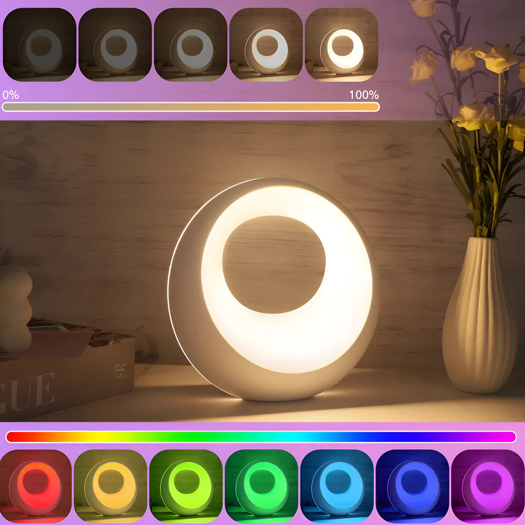 Small white desk lamp with remote control showing RGB colour changing ambient light display