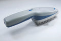 Pet comb with negative ion technology showing removable brush head and 78 comb teeth for grooming with active oxygen release
