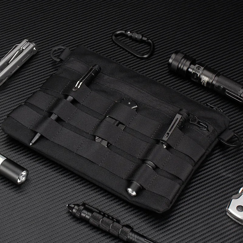 Black Oxford cloth military kit bag showing compact 18cm by 3.5cm size.