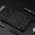 Black Oxford cloth military kit bag showing compact 18cm by 3.5cm size.