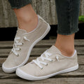 Women's creamy-white casual sneakers with low top fabric upper and rubber sole