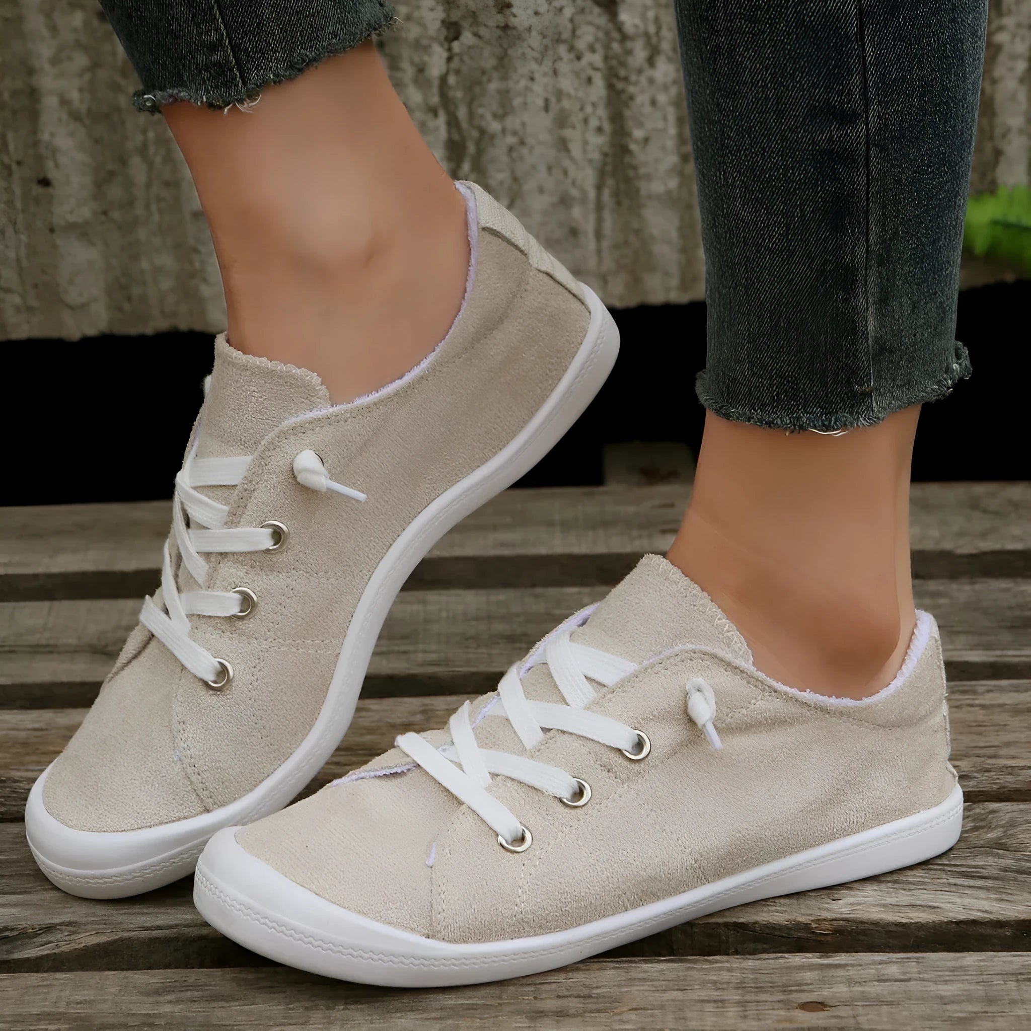 Women's creamy-white casual sneakers with low top fabric upper and rubber sole