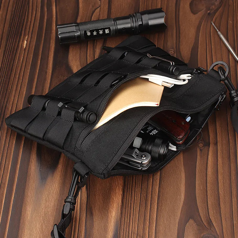 Black Oxford cloth military kit bag showing compact 18cm by 3.5cm size.