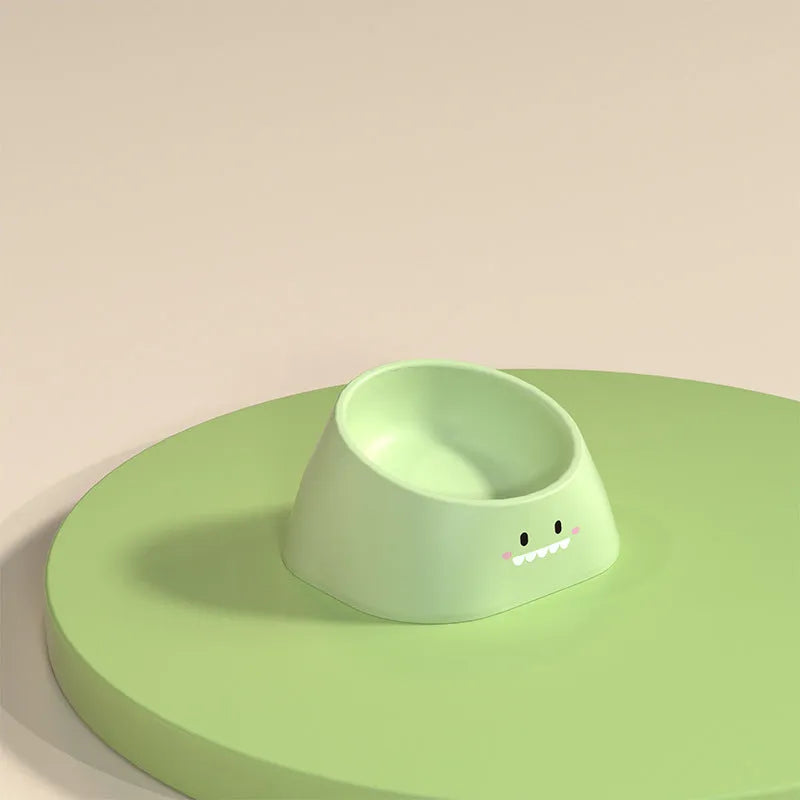 Green 15-degree tilted pet feeding bowl with stainless steel interior and wide PP base for cats and dogs.