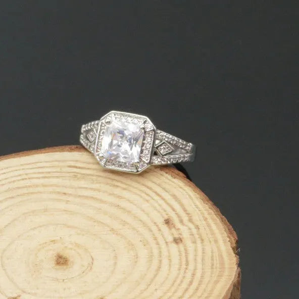 Women's platinum colour geometric zircon ring with hollow ornament design showing quadrilateral pattern