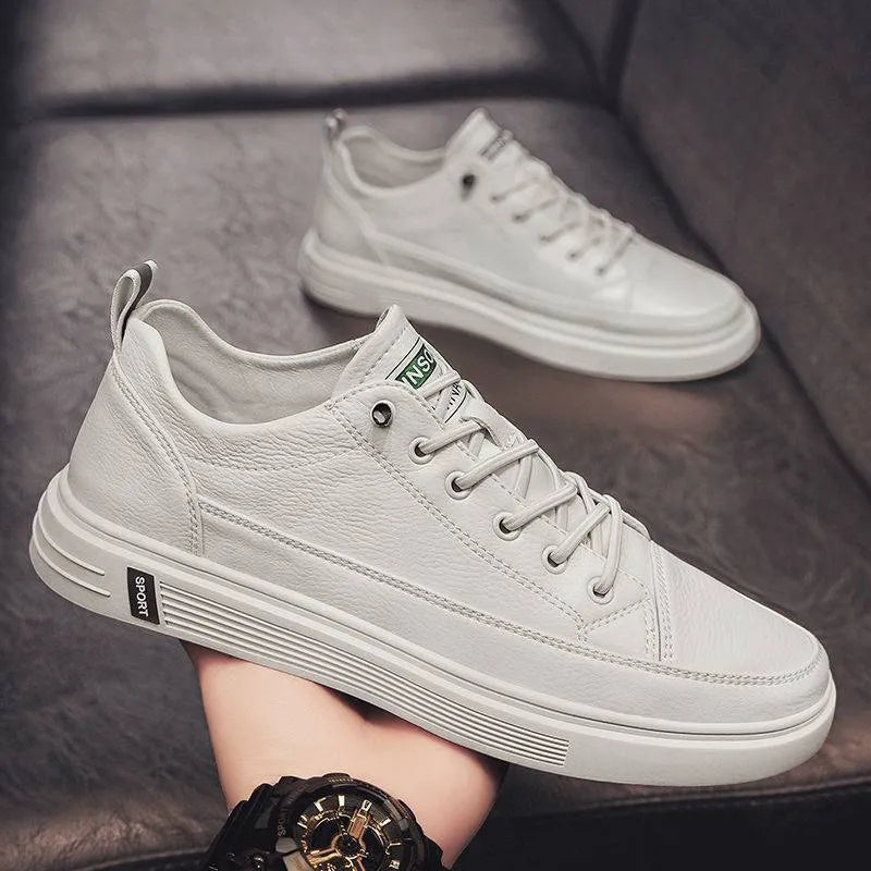 Men's white casual shoes with PU upper, flat sole, and round toe on a plain background.