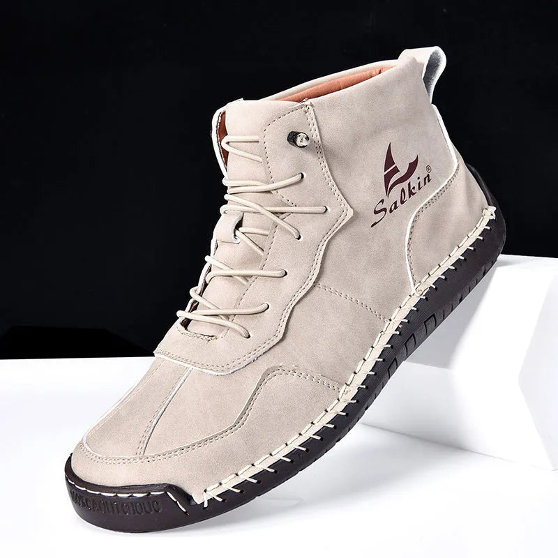 Men's dark blue retro high-top casual boots with lace-up front and elastic band on a white background.