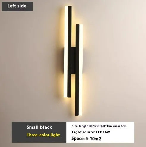 Scandinavian minimalist LED wall light with an acrylic shade on a black arm, mounted on a light-coloured wall.