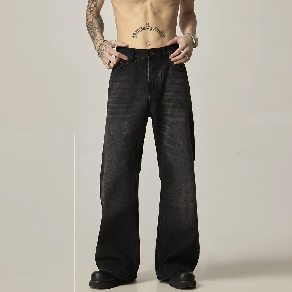 Black loose-fit straight-leg retro jeans with a zipper fly on a mannequin.