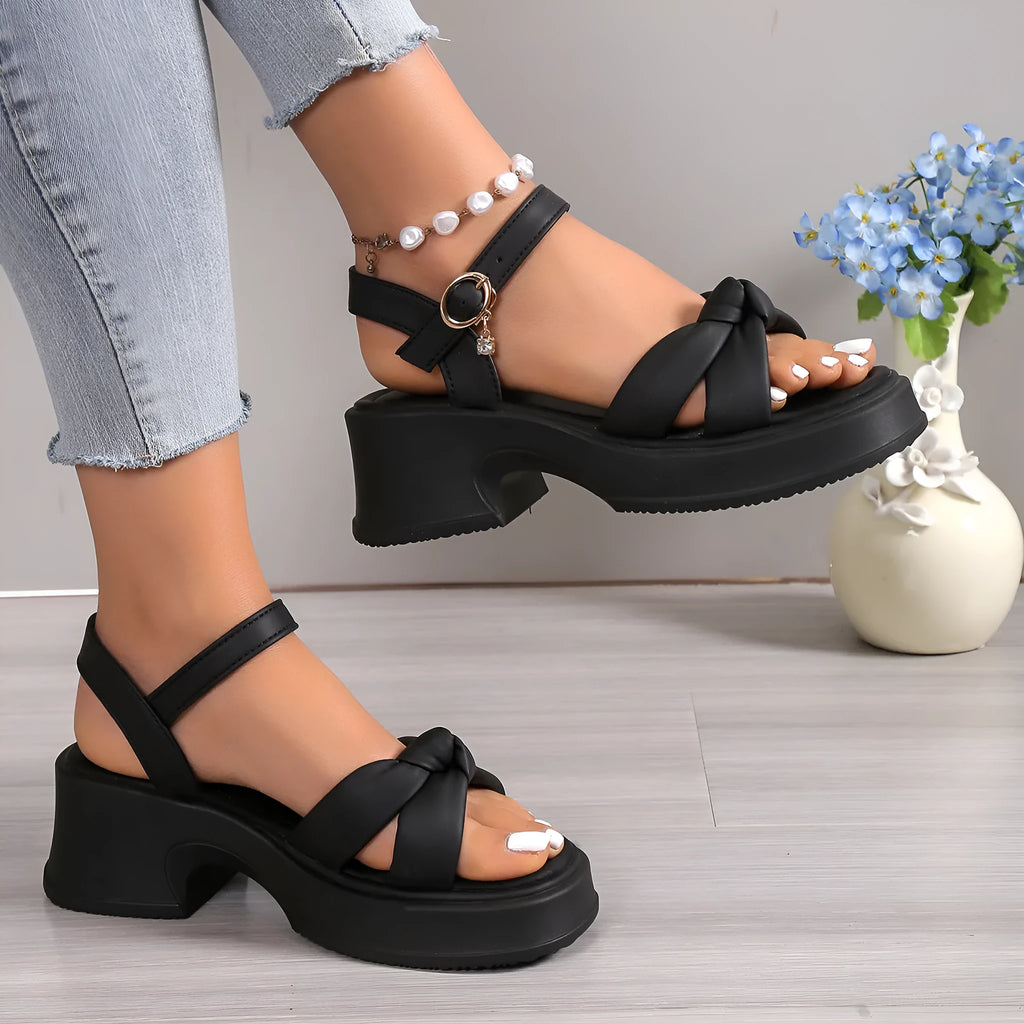 Black women's high heel slippers with thick rubber sole and round toe.