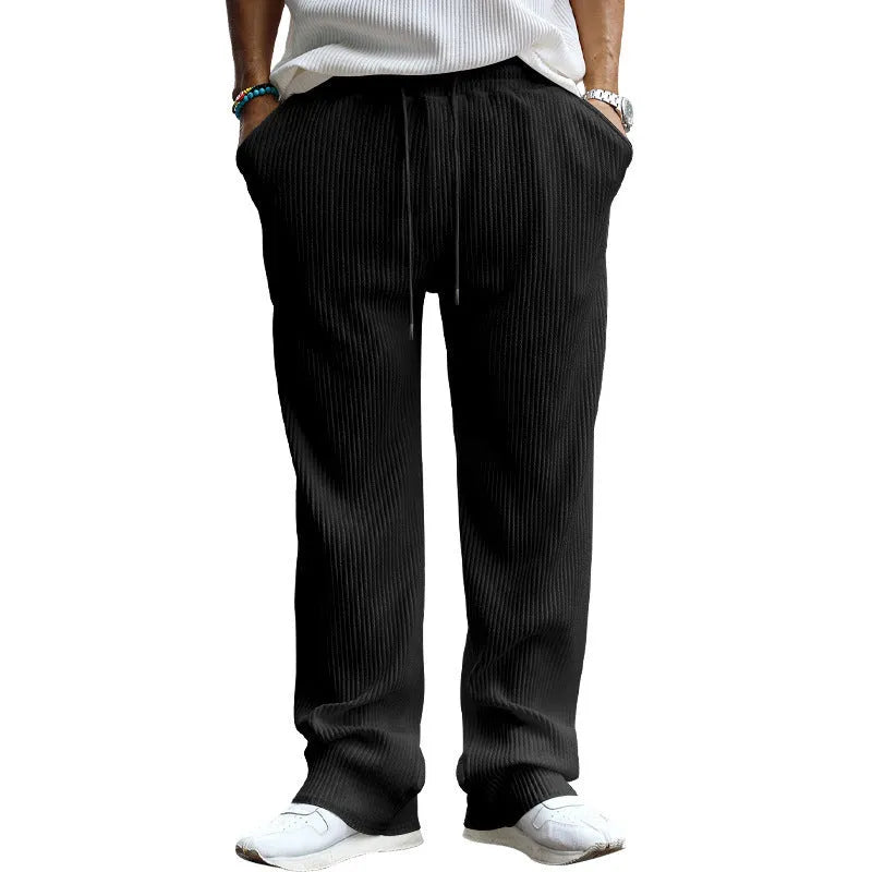 Men's loose fit high waist straight leg trousers in army green colour showing casual styling