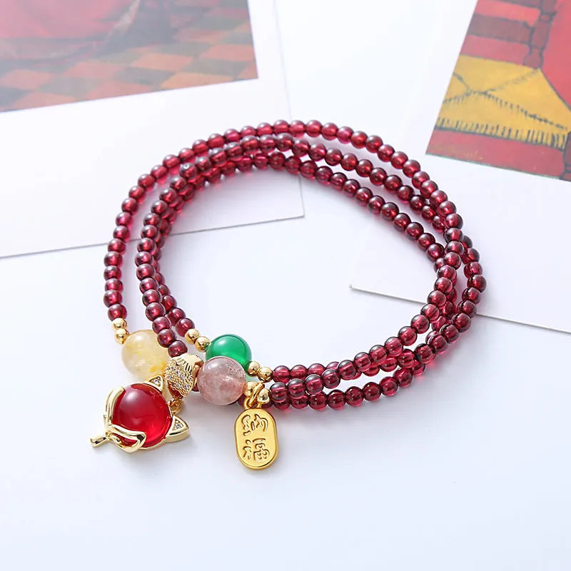 Purplish red garnet fox charm bracelet with adjustable cord fastening for women