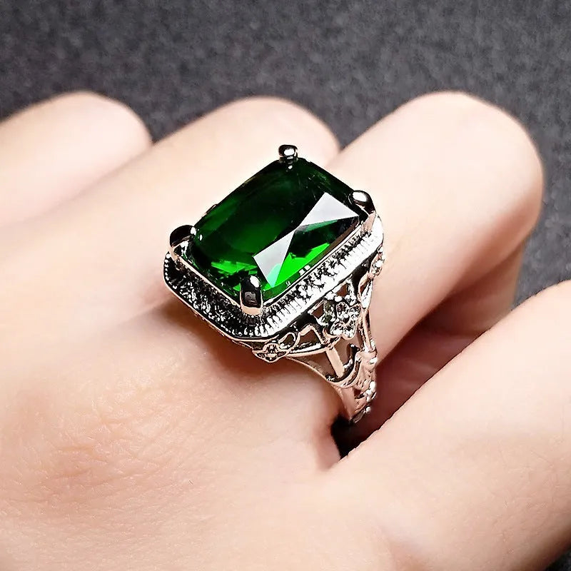Women's geometric ring with pigeons-blood ruby in adjustable platinum colours