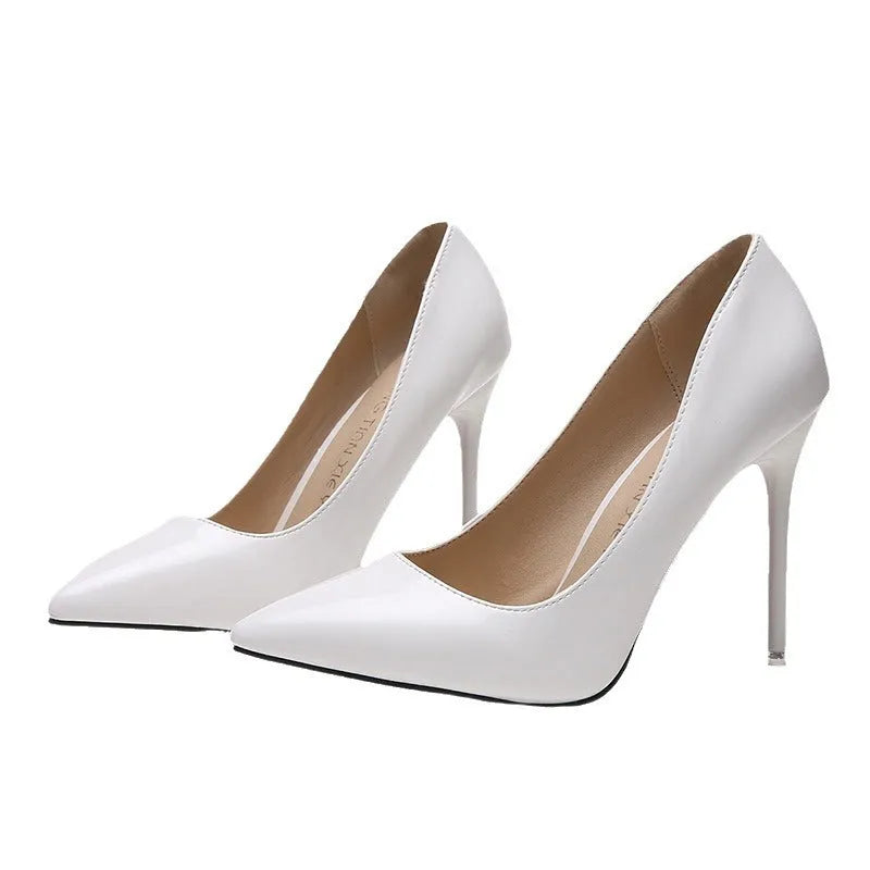 Women's pointed toe stiletto high heel pump in a solid colour with a buckle, shown on a 8cm+ super high heel.