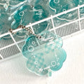 Acrylic four-leaf clover shape mobile phone pendant keychain in blue or green.