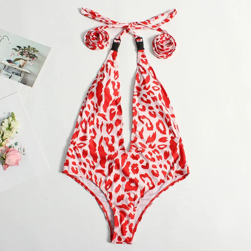Leopard print one-piece swimsuit with bandage design and buckle straps on adult woman