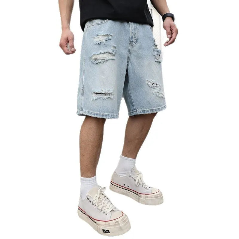 Light blue distressed denim shorts with rips and straight cut design on mannequin